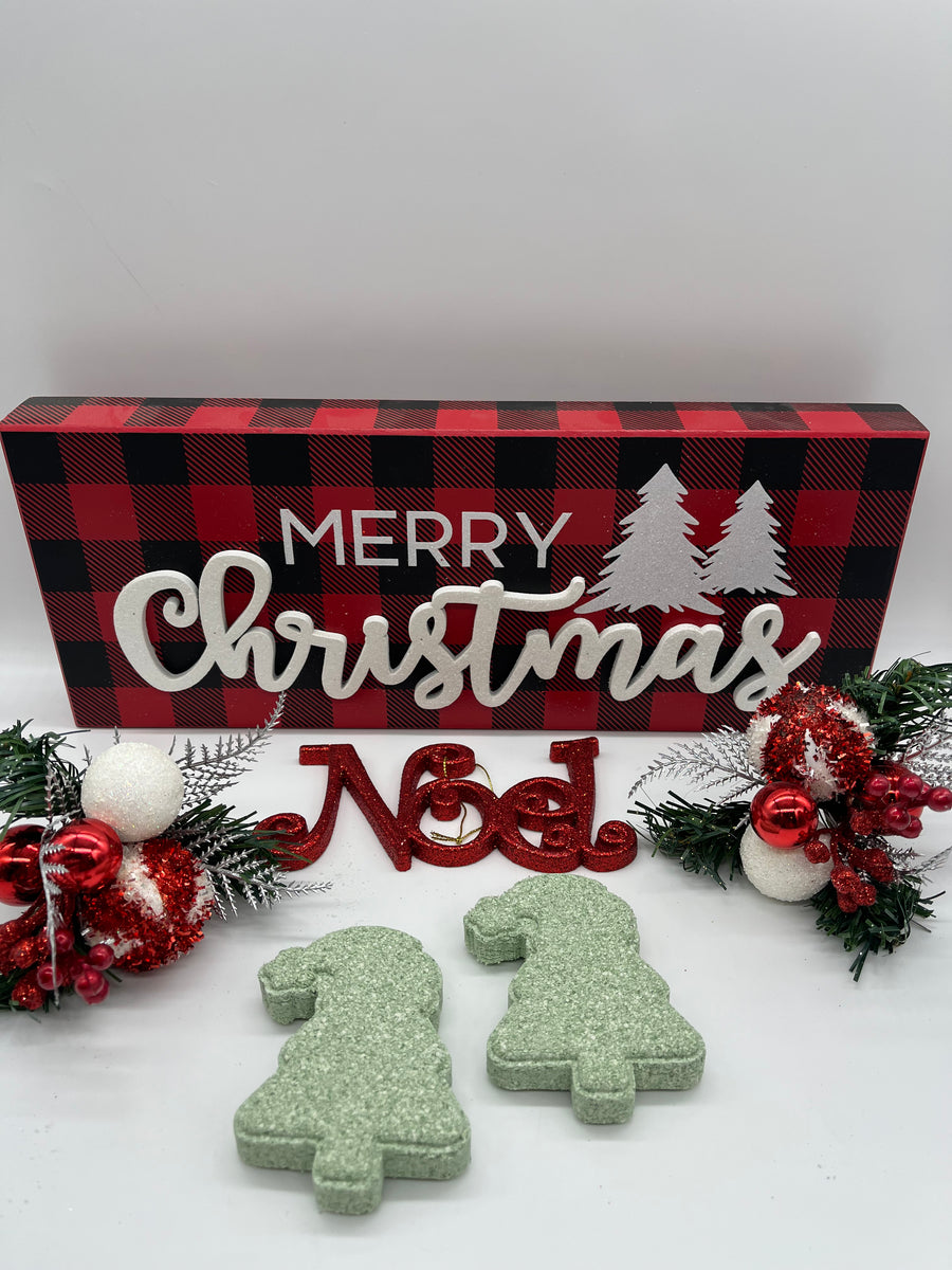 all natural pine scented bath bombs shaped like a christmas tree on a Christmas themed background