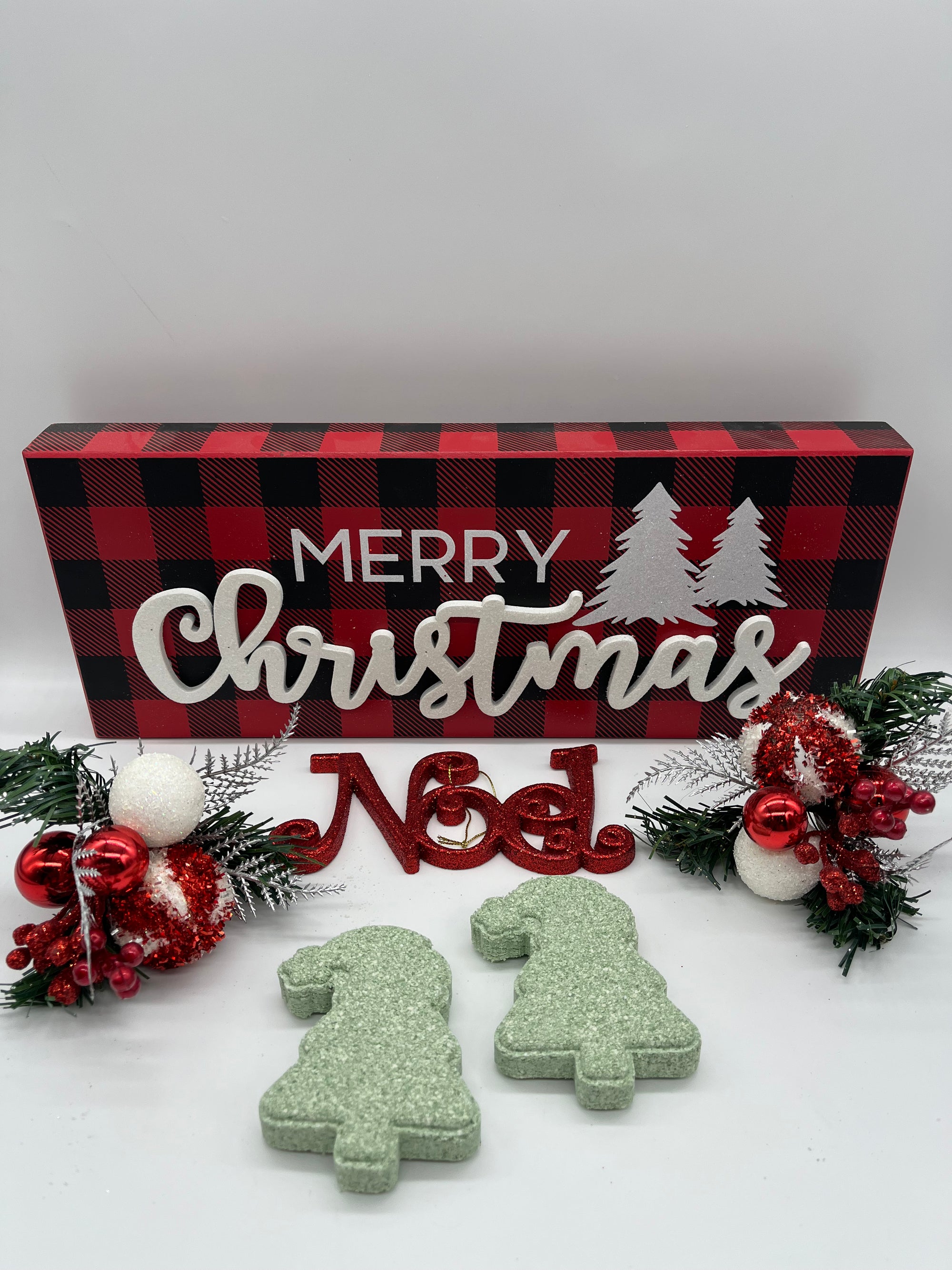 all natural pine scented bath bombs shaped like a christmas tree on a Christmas themed background
