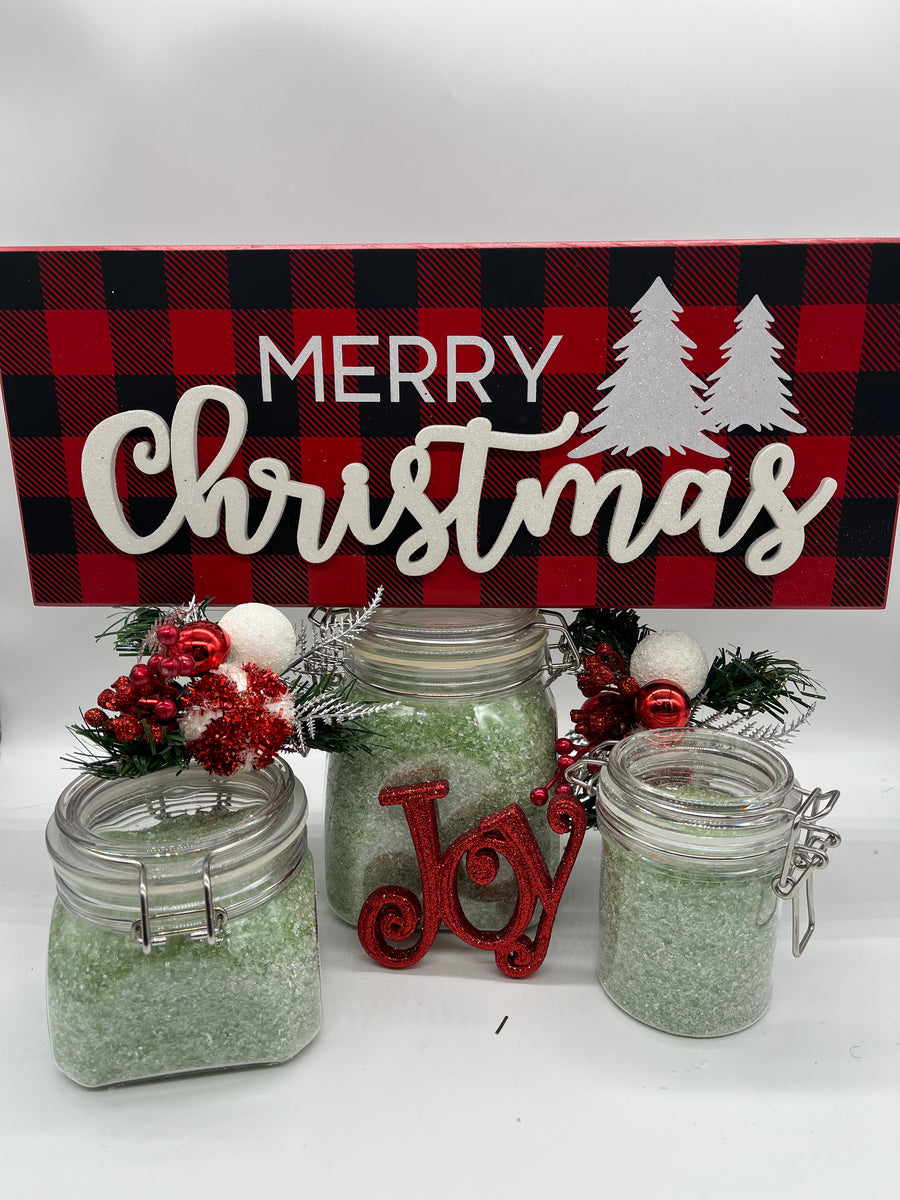 all natural pine scented bath crystals or bath salts on a Christmas themed background