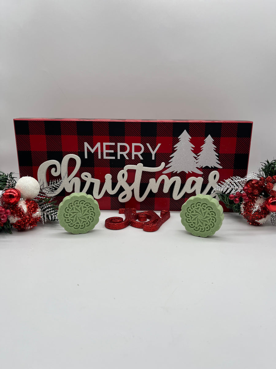 all natural shower steamers on a Christmas themed background