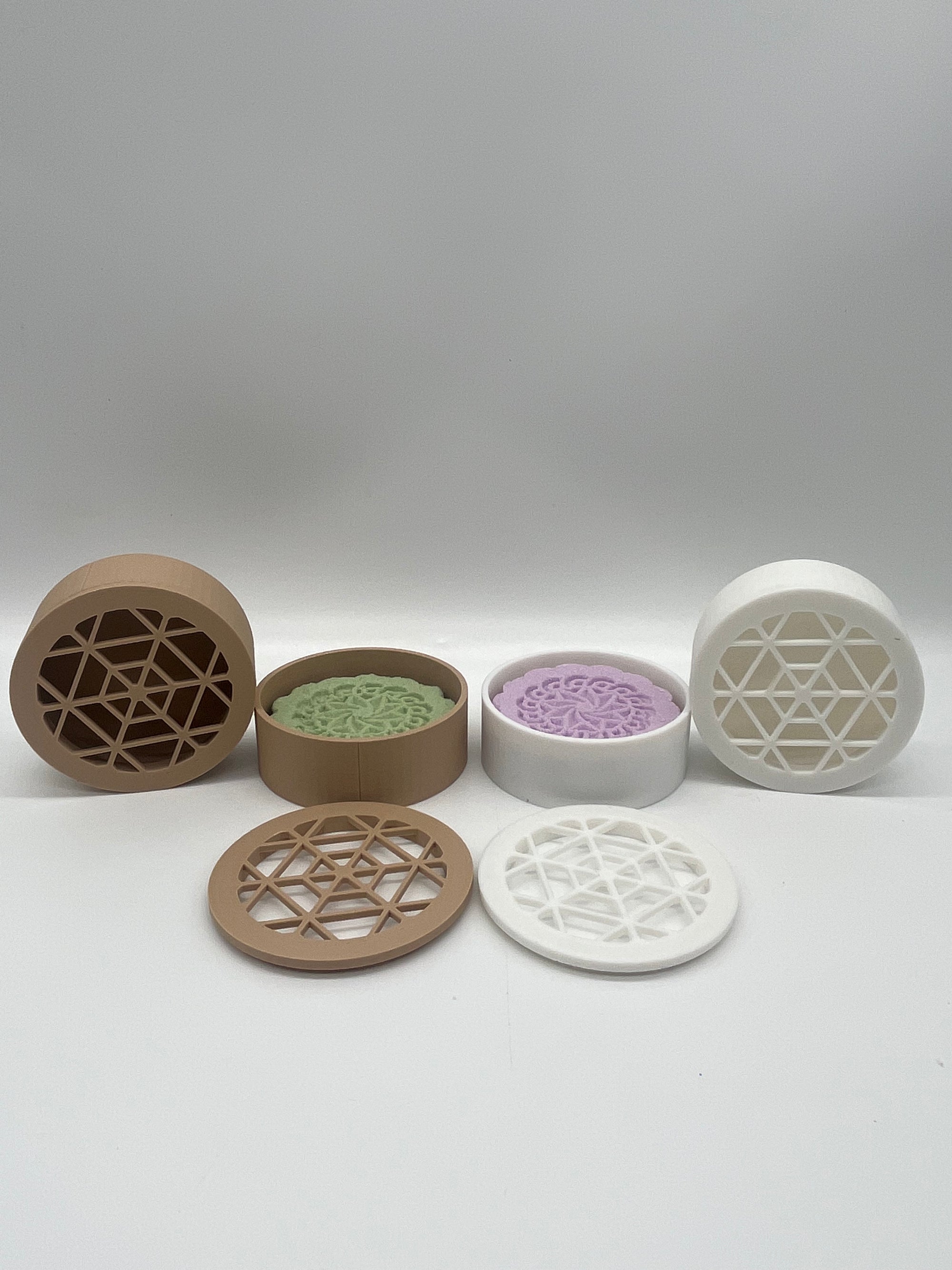 All natural shower steamers and shower steamer caddy's on a white background