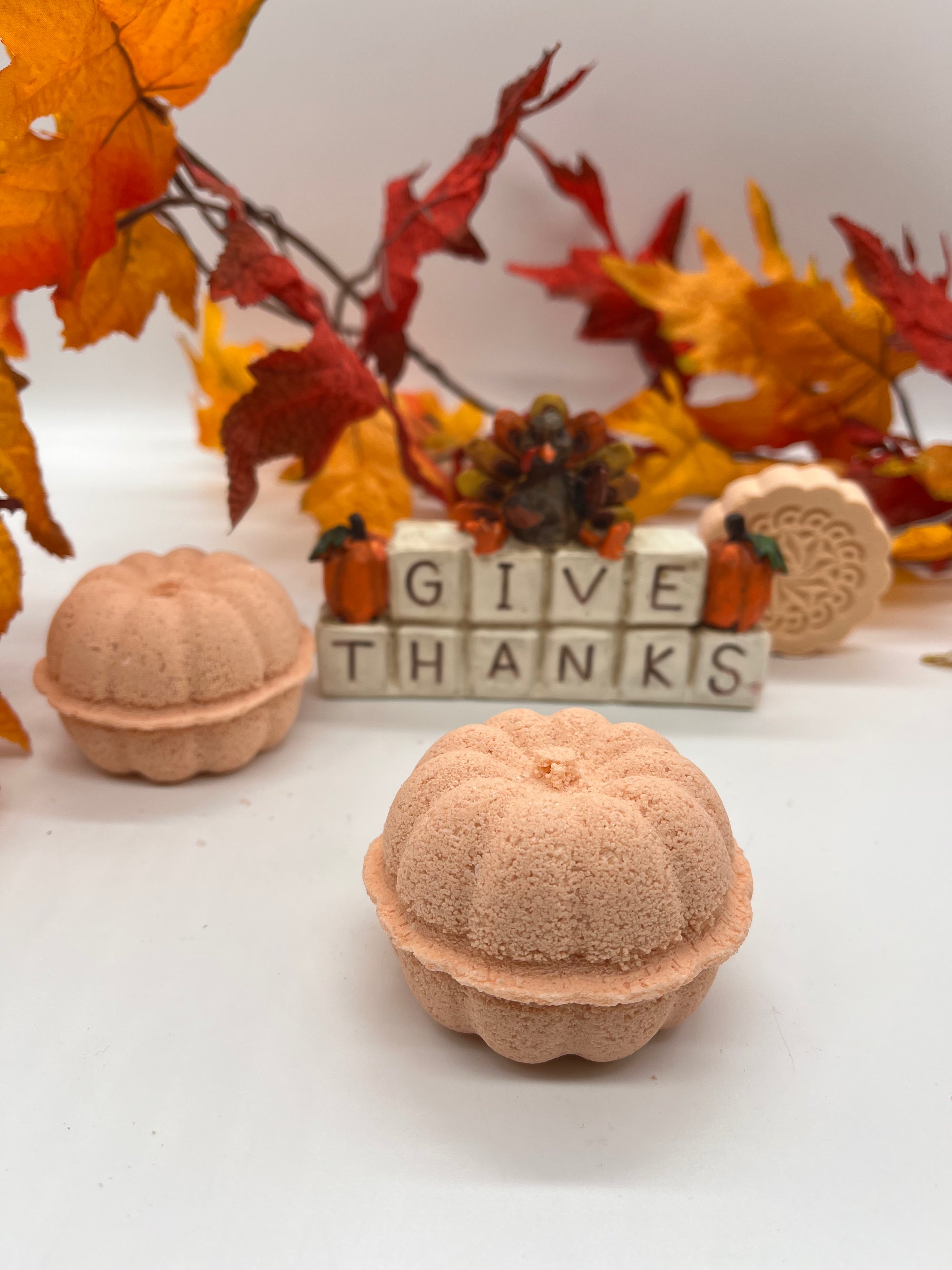 all natural pumpkin spice bath salts with a fall themed background