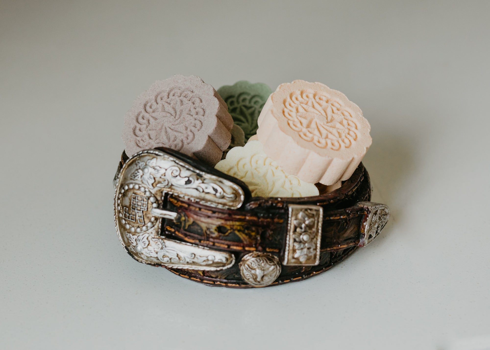 assorted all natural shower steamers inside of a nice belt