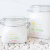 all natural bath crystals or bath salts on a white stone background